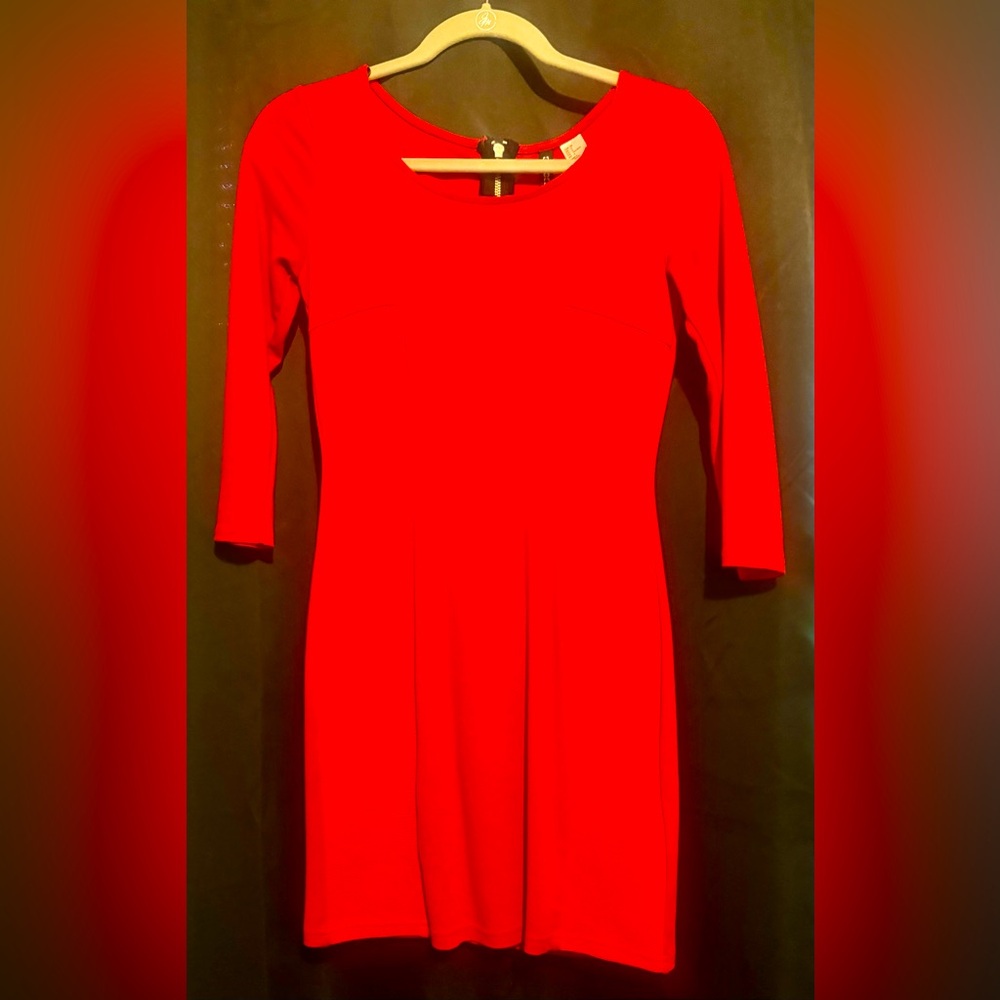 Red sleek party dress with sleeves.